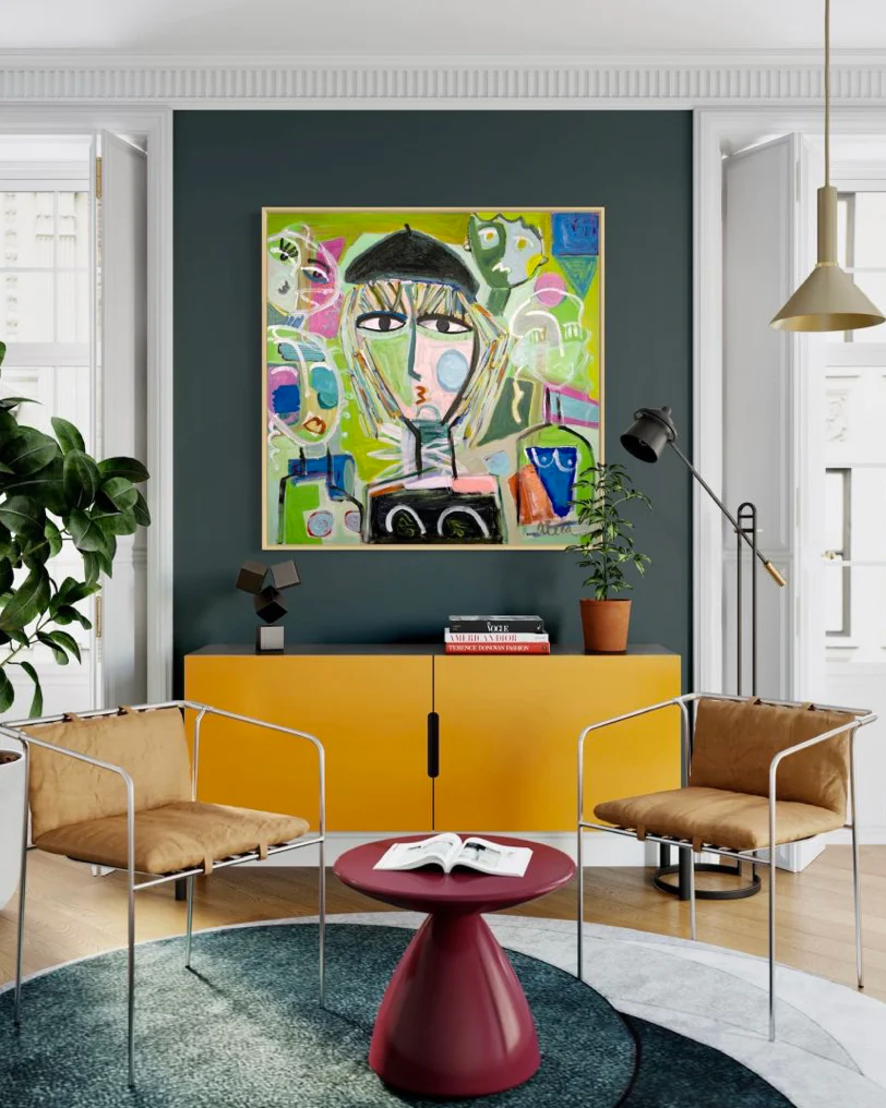 A colorful abstract painting hangs in a contemporary sitting room.