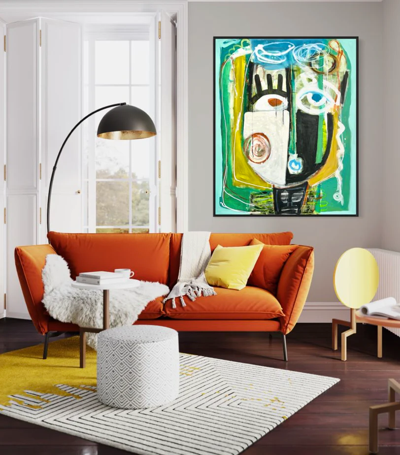 A colorful abstract portrait painting hangs in a contemporary living room.