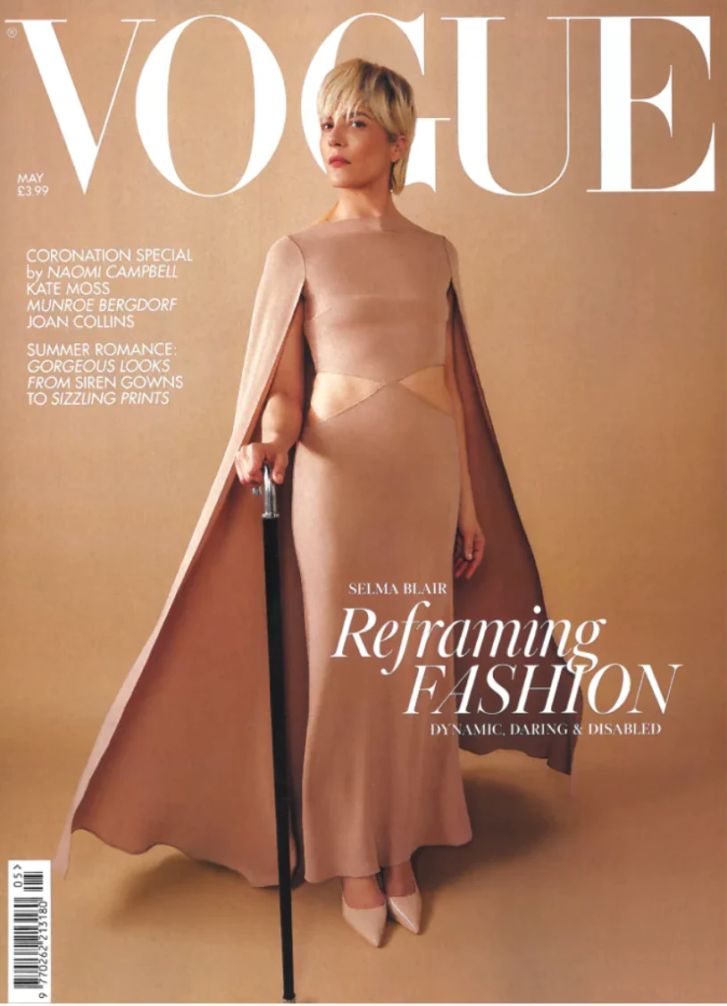 Vogue cover featuring a woman in a beige dress holding a cane.